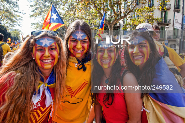 National Day of Catalonia, youth with his face painted with the 