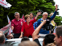 Brazil's President Dilma Rousseff (c) who is presidential candidate for the Workers Party (PT), Alexandre Padilha (l) who is running for gov...