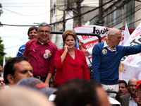 Brazil's President Dilma Rousseff (c) who is presidential candidate for the Workers Party (PT), Alexandre Padilha (l) who is running for gov...