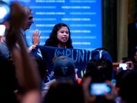 NEW YORK - A member of a militant group disputes President Aquino's speech in the World Leaders Forum in Columbia University on September 23...