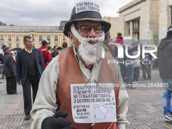 A person with posters at the Labor Day protest in Bogota, Colombia, on May 1, 2018. (