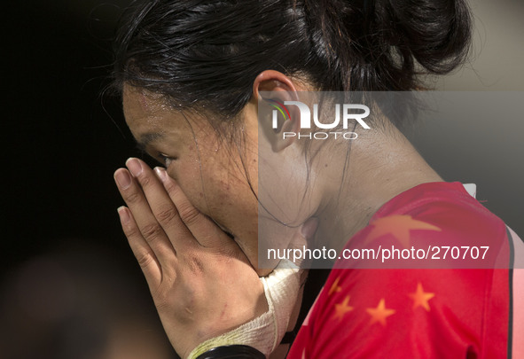 (141002) -- INCHEON, Oct. 2, 2014 () -- Guan Qishi of China sheds tears after the women's rugby final match against Japan at the 17th Asian...