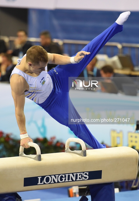 (141003) -- NANNING, Oct. 3, 2014 () -- Oleg Verniaiev from Ukraine performs on the pommel horse during the men's qualifying round of the 45...
