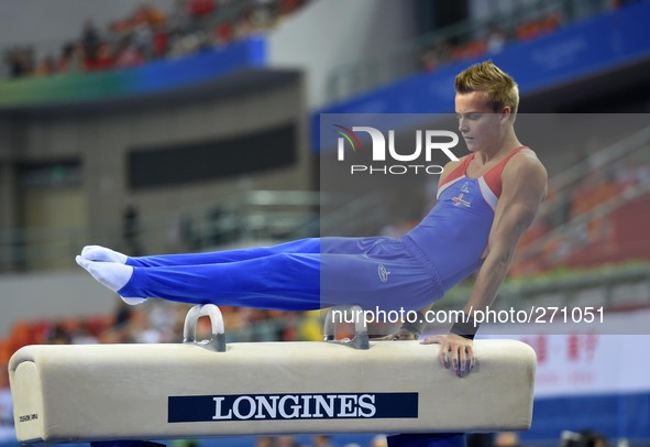 (141003) -- NANNING, Oct. 3, 2014 () -- Valgard Reinhardsson from Iceland performs on the pommel horse during the men's qualifying round of...