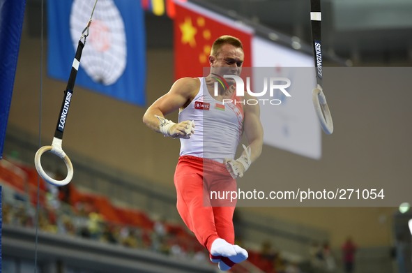(141003) -- NANNING, Oct. 3, 2014 () -- Belarusian gymnast Pavel Bulauski performs on the rings during the men's qualifying round of the 45t...