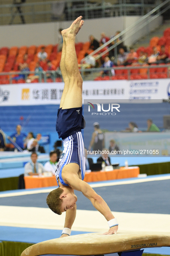 (141003) -- NANNING, Oct. 3, 2014 () -- Eyal Glazer from Israel performs on the vault during the men's qualifying round of the 45th Gymnasti...