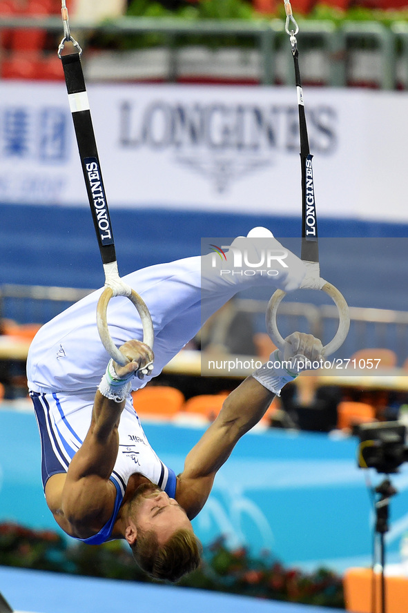 (141003) -- NANNING, Oct. 3, 2014 () -- Alexander Shatilov from Israel performs on the rings during the men's qualifying round of the 45th G...
