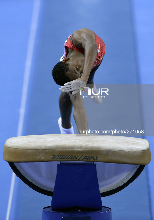 (141003) -- NANNING, Oct. 3, 2014 () -- Angola's gymnast Joso Epalanga performs on the vault during the men's qualifying round of the 45th G...