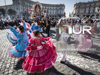 ROME, ITALY - OCTOBER 5: Children dressed in traditional costumes dance while participating in a procession in Rome honoring, Peru's most re...
