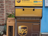 A United Parcel Service of America truck and drop-off box are seen along Milwaukee Avenue in the Old Irving Park neighborhood of Chicago, IL...