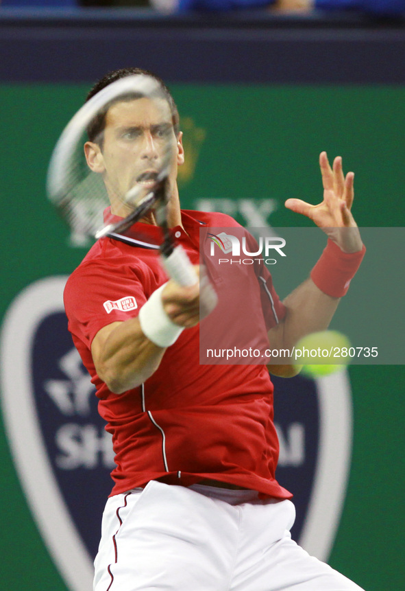 (141008) -- SHANGHAI, Oct. 8, 2014 () -- Serbia's Novak Djokovic returns the ball during the men's singles second round match against Austri...