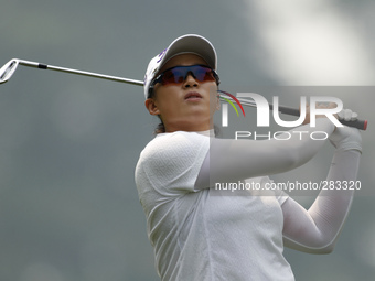 Amy Yang of Korea watches her shot on the fairway of hole 8 during the second round of the LPGA Malaysia golf tournament at Kuala Lumpur Gol...