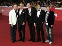 Members of Spandau Ballet pop band (from left) Martin Kemp, Gary Kemp, Tony Hadley, Steve Norman and John Keeble, pose on the red carpet as...