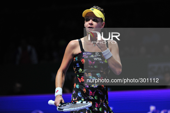(141022) -- SINGAPORE, Oct. 22, 2014 () -- Poland's Agnieszka Radwanska celebrates during the WTA Finals singles tennis match against the Cz...