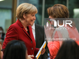 Visitors react during the speech of Angela Merkel at the Integration Conference at the CDU-Party central on October 22, 2014 in Berlin, Germ...