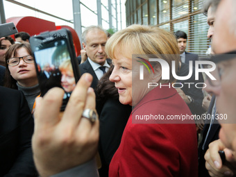 Chancellor Angela Merkel signed autographs in the crowd during a Integration Conference at the CDU-Party central on October 22, 2014 in Berl...