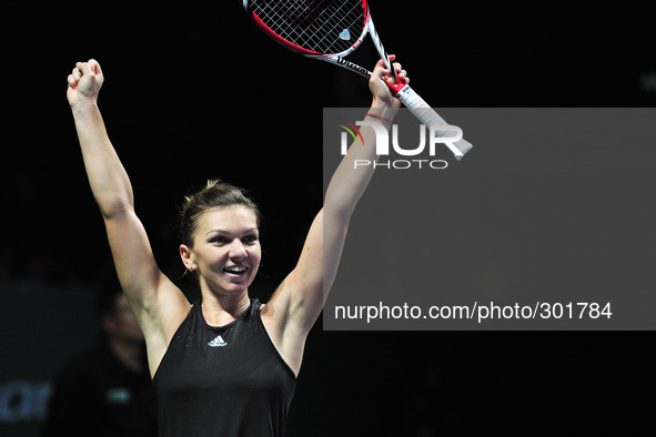 (141022) -- SINGAPORE, Oct. 22, 2014 () -- Romania's Simona Halep celebrates after winning the round robin match of the WTA Finals against S...