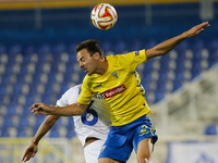 Estoril's defender Ruben Fernandes (F) heads for the ball with Dynamo Moscow's midfielder William Vainqueur (B) during the UEFA Europa Leagu...