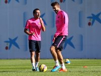 24 October-BARCELONA SPAIN: Xavi Hernandez and Gerard Pique in training held at the Joan Gamper Sports City before the match against Real Ma...