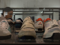 Various different designs of Adidas footwear on display at a special exhibition in central Manchester. (