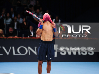 Borna Coric (CRO) covers his head with his shirt after loosing a point during the semi final of the Swiss Indoors  at St. Jakobshalle in Bas...