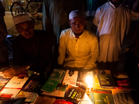 Young men set up a small book stall to sell Islamic books to the Muslims. (
