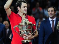 Roger Federer with the Swiss Indoors trophy at St. Jakobshalle in Basel, Switzerland on October 26, 2014. (