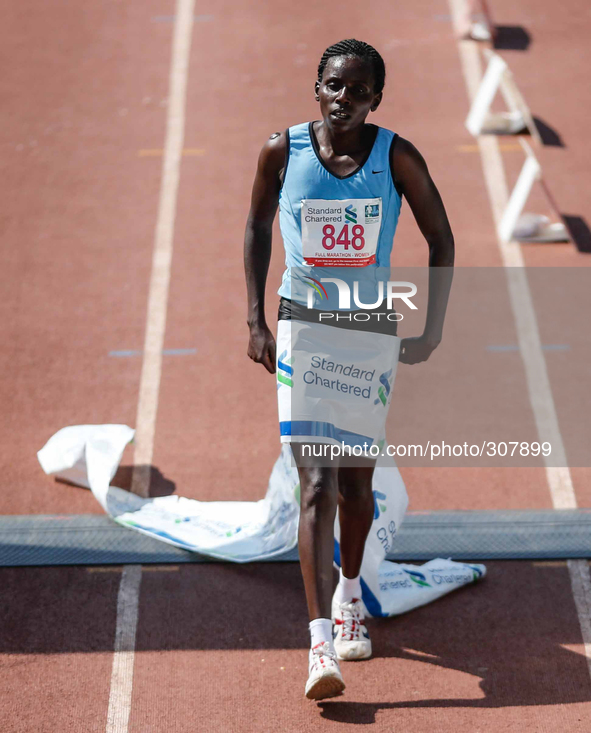 (141026) -- NAIROBI, Oct. 26, 2014 () -- Jeptoo Eunice of Kenya runs across the finishing line during the 2014 Nairobi Marathon in Nairobi,...
