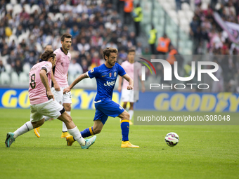 Claudio Marchisio and Edgar Barreto during the Serie A match betweenJuventus FC and U.S Palermo at Juventus Stafium  on october 26, 2014 in...