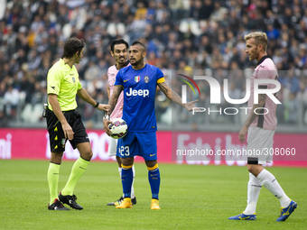  Arturo Vidal, Luca Rigoni and the referee Gianpaolo Calvarese during the Serie A match betweenJuventus FC and U.S Palermo at Juventus Stafi...