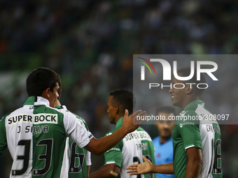 Sporting´s forward Andre Carrillo (R) celebrates with team mates after a goal of  Maritimo's defender Patrick Bauer (a.g) during the Portugu...
