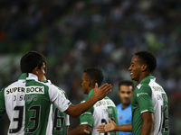 Sporting´s forward Andre Carrillo (R) celebrates with team mates after a goal of  Maritimo's defender Patrick Bauer (a.g) during the Portugu...