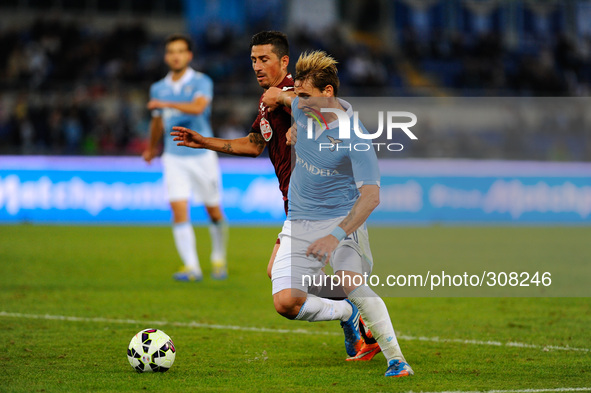Biglia and Vives during the Serie A match between SS Lazio and Torino at Olympic Stadium, Italy on October 26, 2014. 