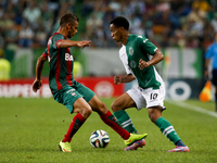 Maritimo's forward Edgar Costa (L) vies with Sporting's forward Andre Carrillo (R) during the Portuguese League  football match between Spor...