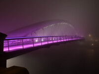 A foggy night view of the Father Bernatka Footbridge on 29th October 2014 in Krakow.
Krakow's Father Bernatka Footbridge is a footbridge fo...