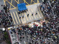 25th of October, 2015. Hong Kong, Kowloon district, Mong Kok. Occupy Central protesters stand behind a police cordon in Mong kok.  (