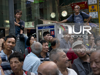 25th of October, 2015. Hong Kong, Kowloon district, Mong Kok. Curious citizens spend the time at the Mong kok occupation.  (