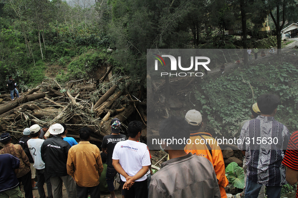 Residents look at debris timber of cold lava eruption of Mount Sinabung has been eroding for landslide threatens villages Mardinding, Karo,...