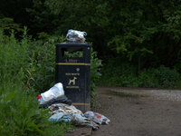 Waste gathering at the side of a bin on the Heaton Mersey Common, in Stockport. (