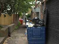 A bin which has become full with litter behind a commercial resturant in Cheadle, Stockport. (