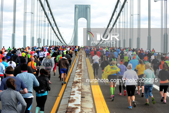 Runners cross the Verrazano-Narrows Bridge at the start of the TCS New York City Marathon on November 2, 2014 in the Brooklyn borough of New...
