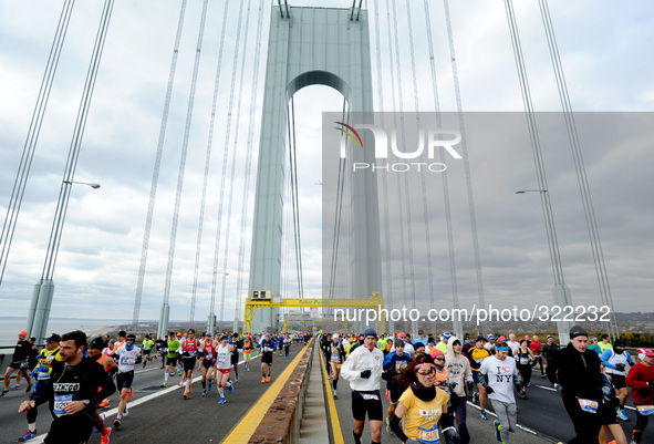 Runners cross the Verrazano-Narrows Bridge at the start of the TCS New York City Marathon on November 2, 2014 in the Brooklyn borough of New...