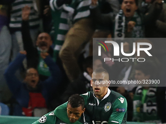 Sporting's midfielder Nani (L) celebrates his goal with Sporting's forward Islam Slimani (R)  during the UEFA Champions League  group G foot...