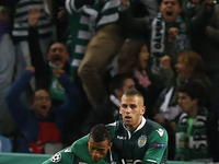 Sporting's midfielder Nani (L) celebrates his goal with Sporting's forward Islam Slimani (R)  during the UEFA Champions League  group G foot...