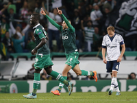 Sporting's forward Islam Slimani (C) celebrates his second goal with his teammates during the UEFA Champions League  group G football match...