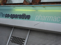 A sign for a UK Co-Operative Pharmacy. (