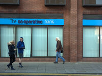 People waling by a branch of the Co-Operative Bank. (