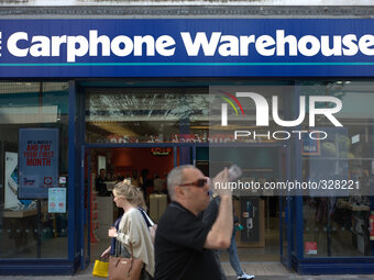People outside The Carphone Warehouse in central Manchester as an older male takes a drink of his water. (
