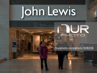 The people walking away from the entrance to a John Lewis store. (