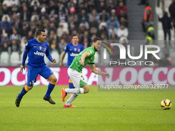 Carlos Tevez and Andrea Rispoli during the Serie A match between Juventus FC and Parma FC. at Juventus Stafium  on november 9, 2014 in Torin...